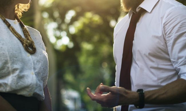Business people talking together in the park